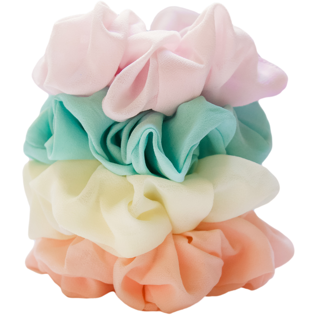 Stack of pastel colored chiffon scrunchies in peach, pale yellow, aqua, and light purple